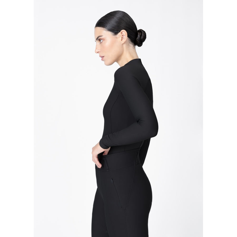 Side view of women’s black Origin Base Layer highlighting second-skin fit and stretch performance fabric.