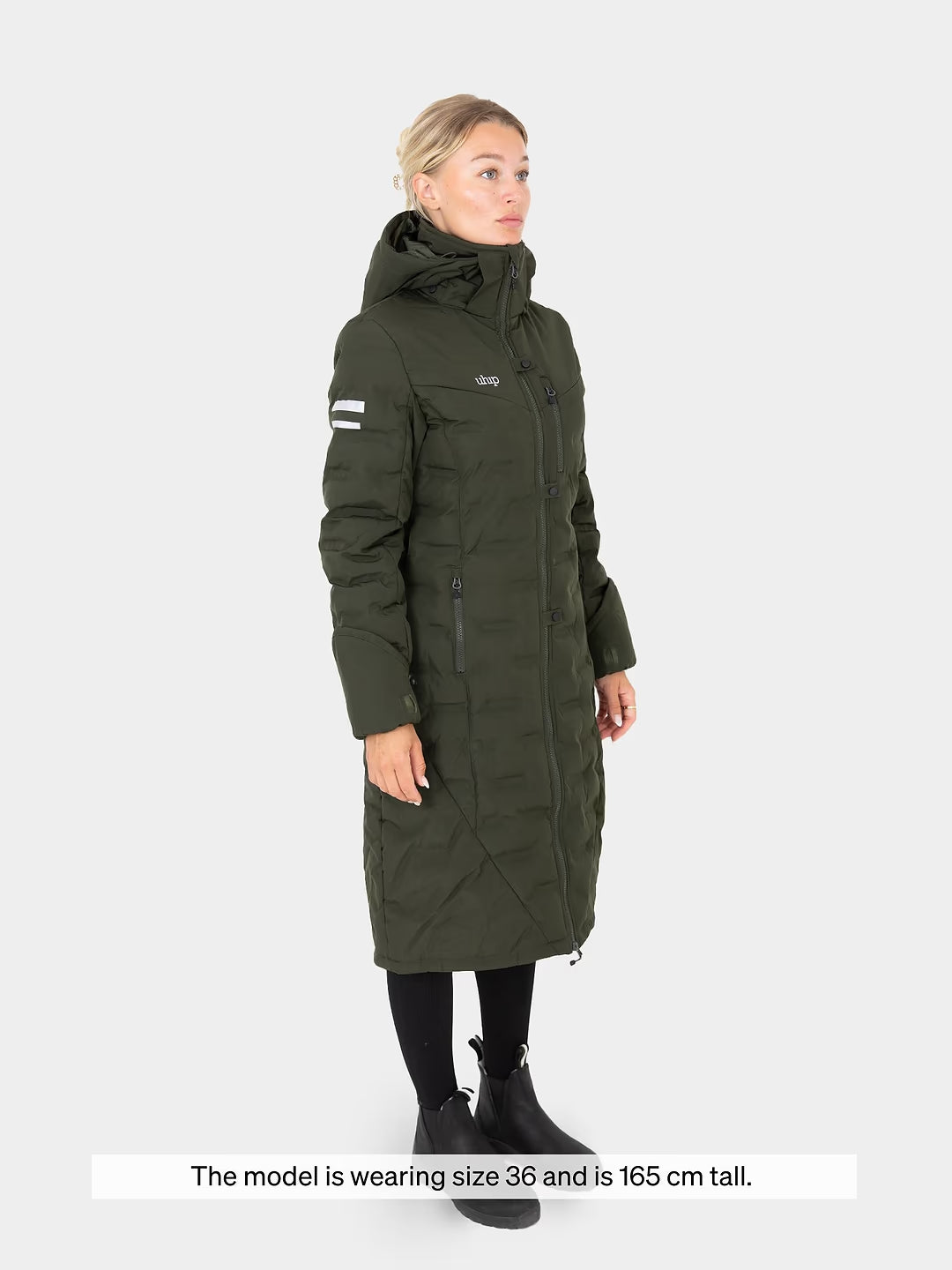 Woman wearing a Uhip Ice Coat in Dark Green on a white background