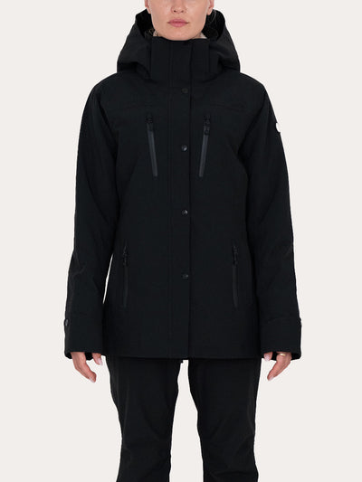 A model wearing a  black Uhip Rainy Jacket with multiple zippered pockets, paired with black pants, against a solid light grey background.