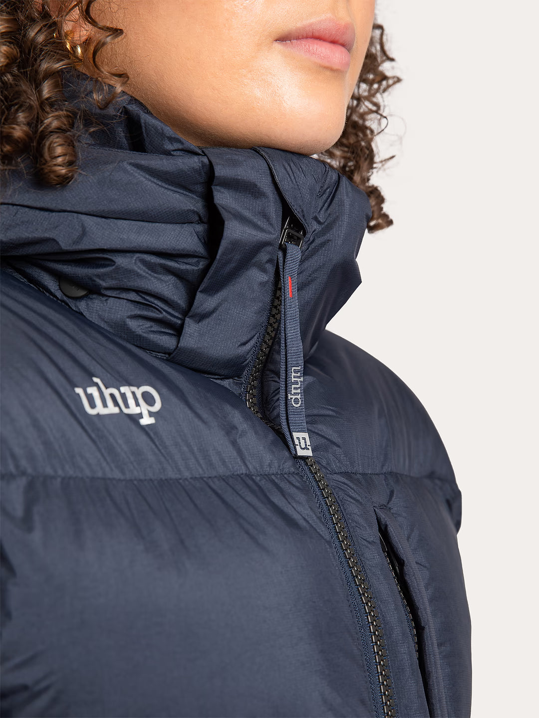 Uhip Arctic Puffer Coat in Eclipse colour - women's long insulated winter coat neck and zip view for horse riding, dog walking and outdoor winter wear.